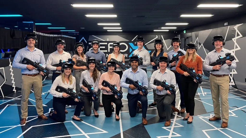 Teammates competing and cheering during a corporate VR showdown at Nexus Lounge